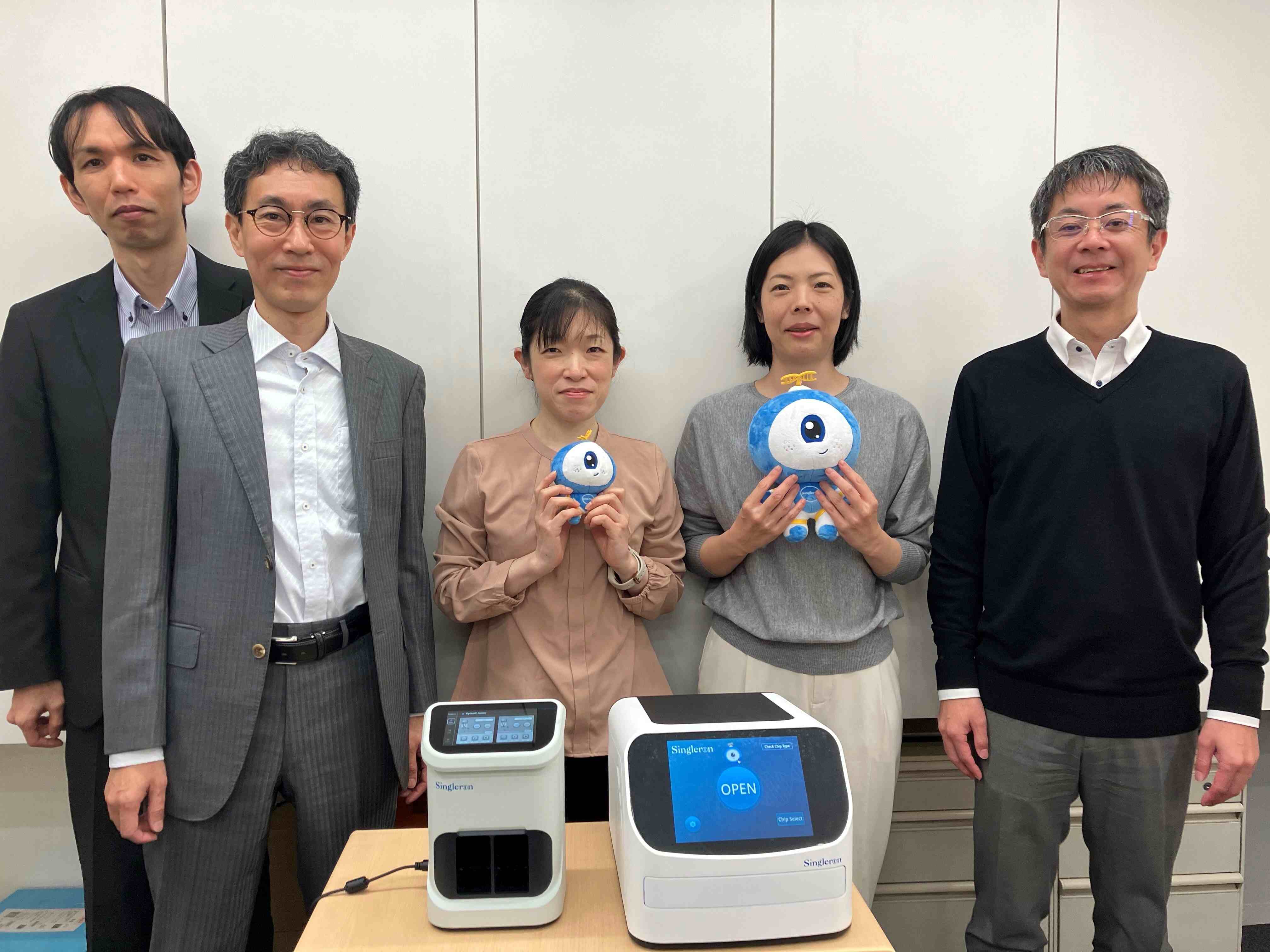 The TOMY Digital Biology Co., Ltd team with Singleron's PythoN Junior™ and Matrix NEO™ systems for automated tissue dissociation and single cell processing workflow. From left: Yuki Tatehashi, Sales; Hideo Tanaka, VP Technical Support; Etsuko Sugai, Field Application Specialist; Hiroko Kinoshita, Field Application Specialist; and Junichi Sunaga, Managing Director.