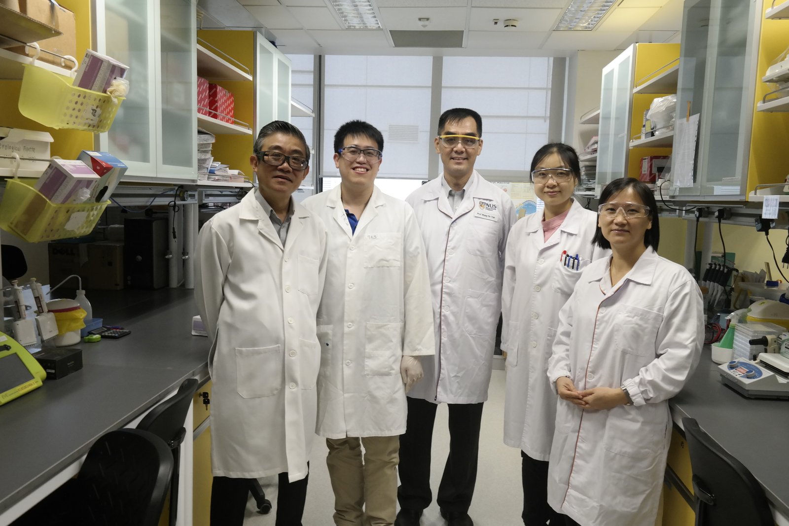 (from left to right): Assoc Prof Vincent Chow, Dr Kai Sen Tan, Prof Wang De Yun, Ms Qiao Yongkang and Asst Prof Thai Tran (lead PI).